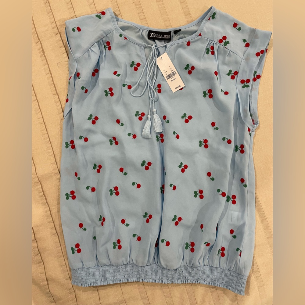 Light blue top with cherries. Brand new.